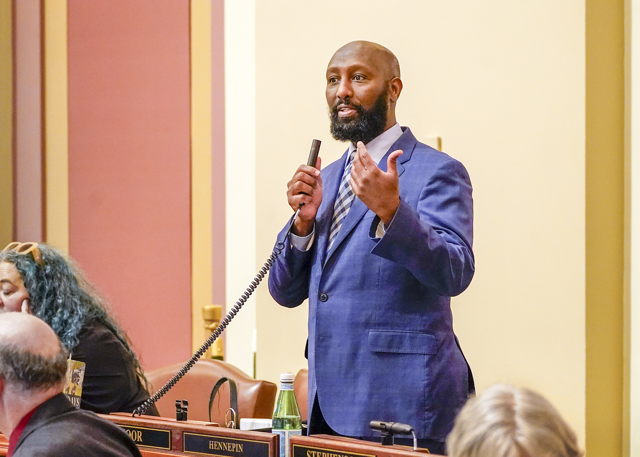 Rep. Mohamud Noor describes the human services supplemental budget bill on the House Floor May 6. (Photo by Andrew VonBank)